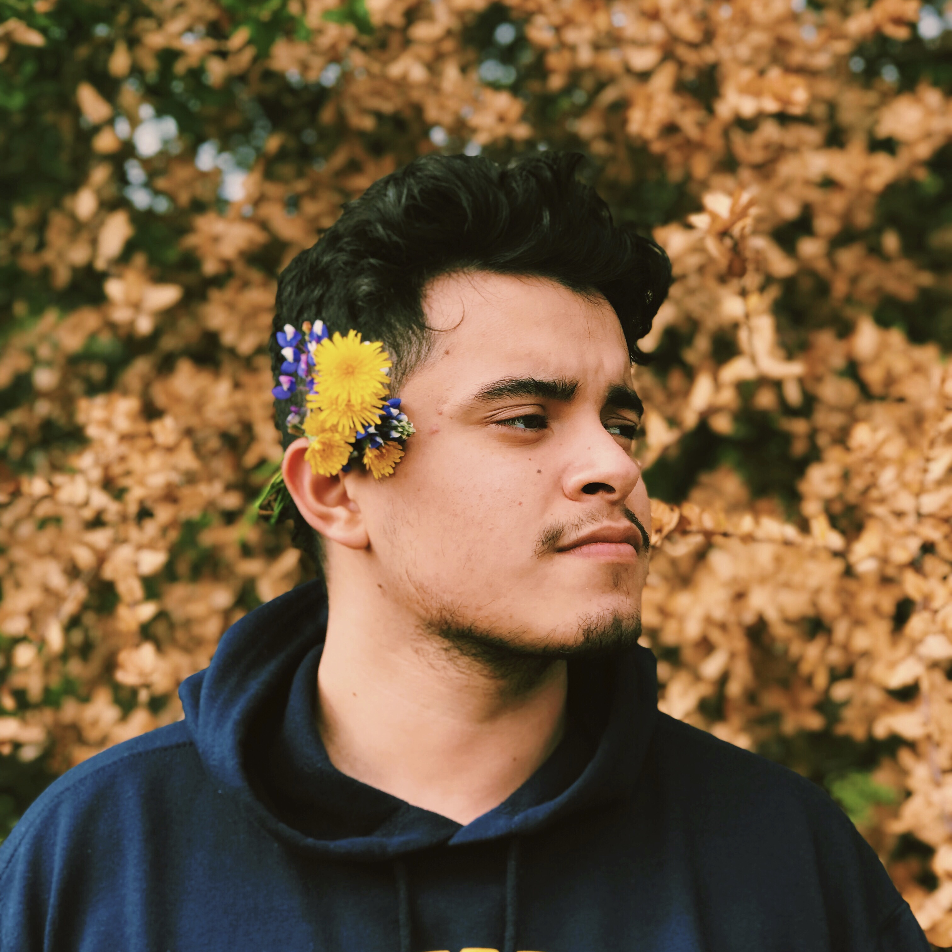 photo of erick martinez in front of leaves