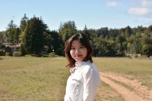 photo of shannon wong smiling in front of U C santa cruz forest