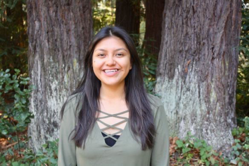 photo of valeria blanco smiling in front of redwood trees